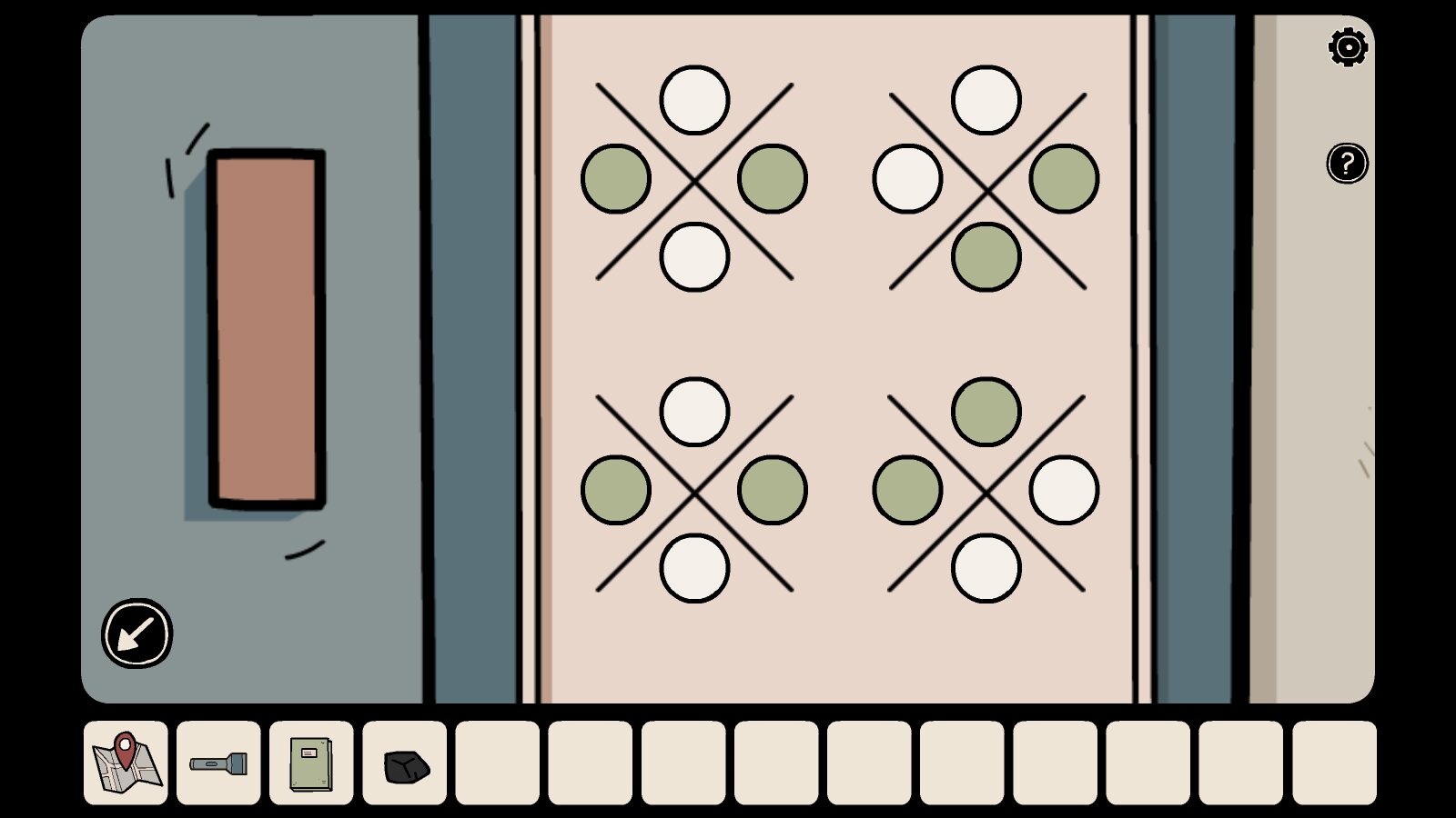 Completed naughts and crosses puzzle on the safe. 